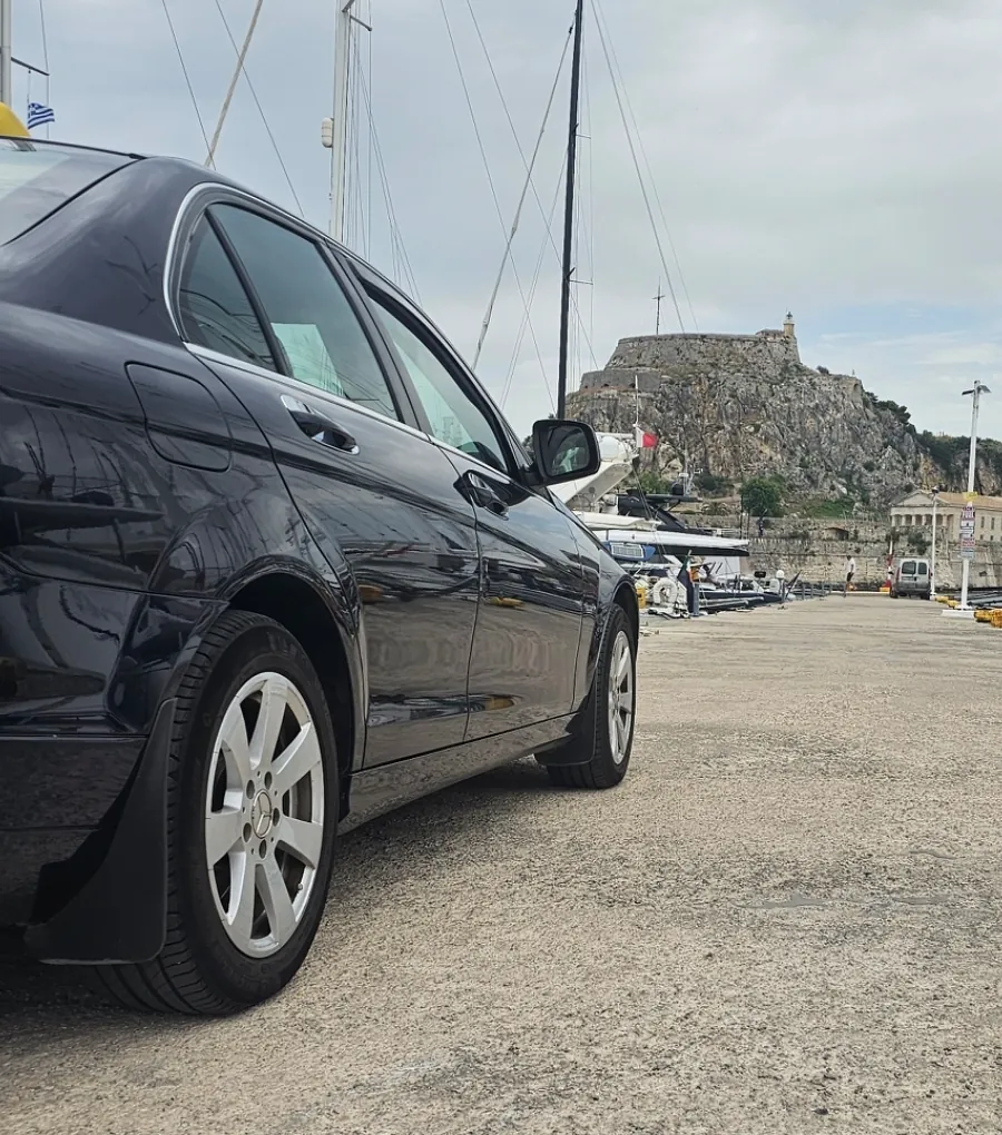 The taxi at the marina, the Old Fortress behind it